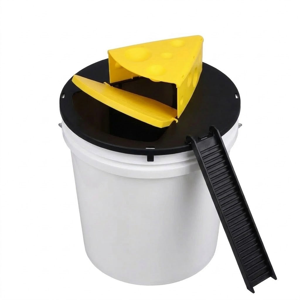 The yellow plate tipping on its pivot, its cheese-side edge dropping into the bucket under the wedge